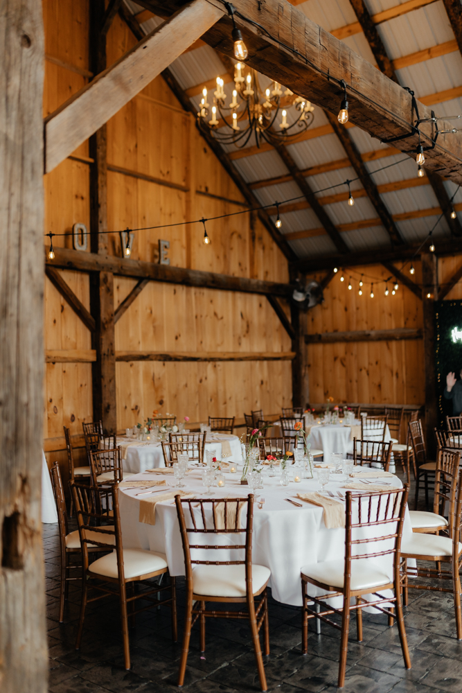 wedding tablescape with white linens at the Barn at Pinestone