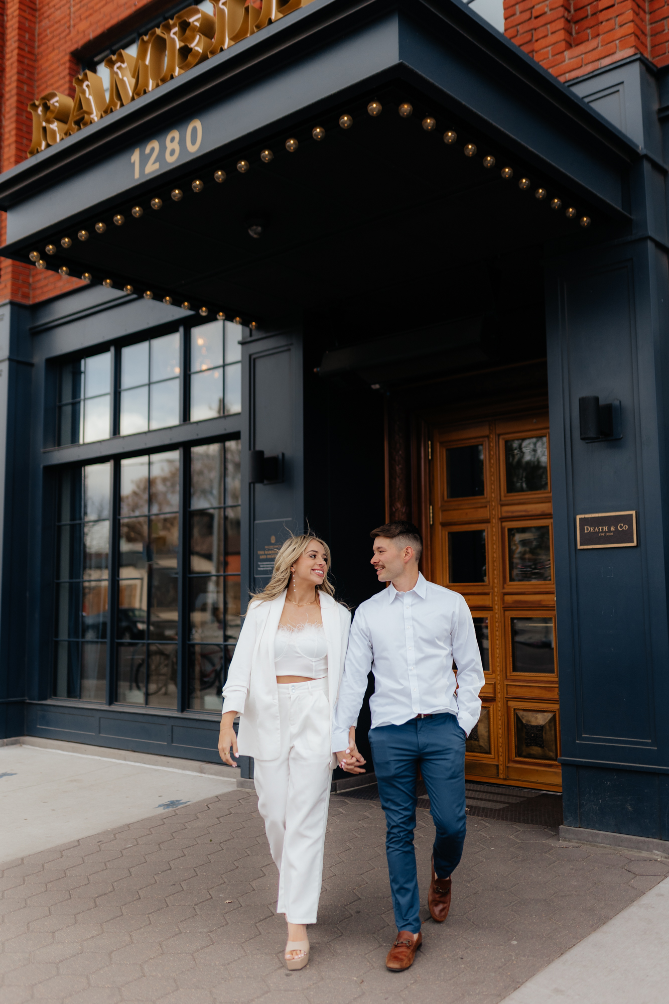 Couple walking in front of Ramble Hotel in Downtown Denver Colorado