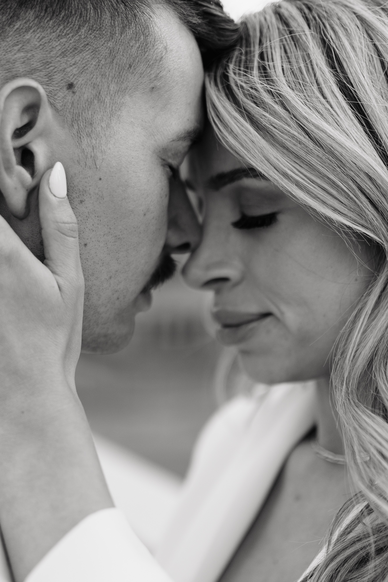 Sweet intimate moment between couple in black and white