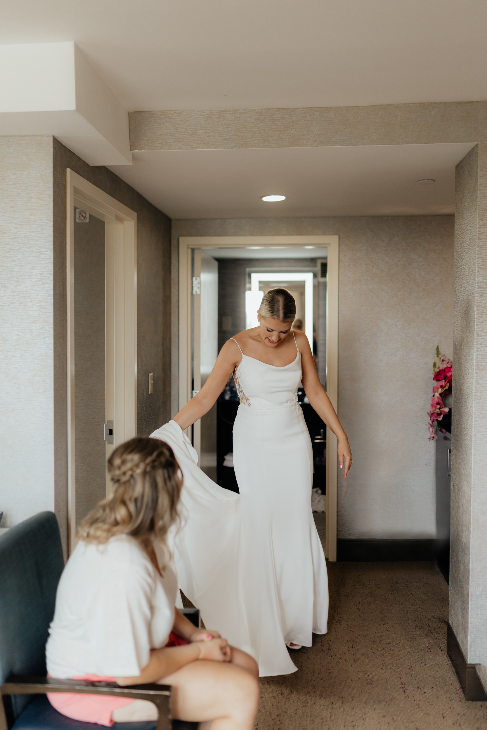 Bride gets in her dress on her wedding day