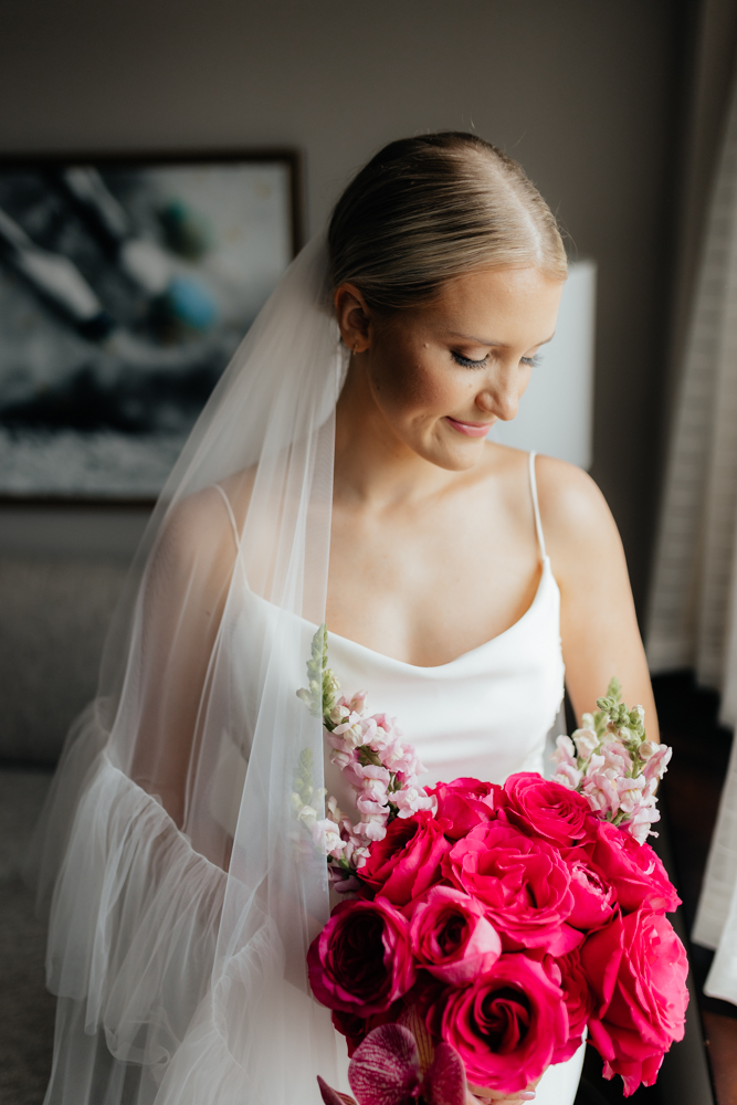 Elegant bride with pink flowers on her wedding day
