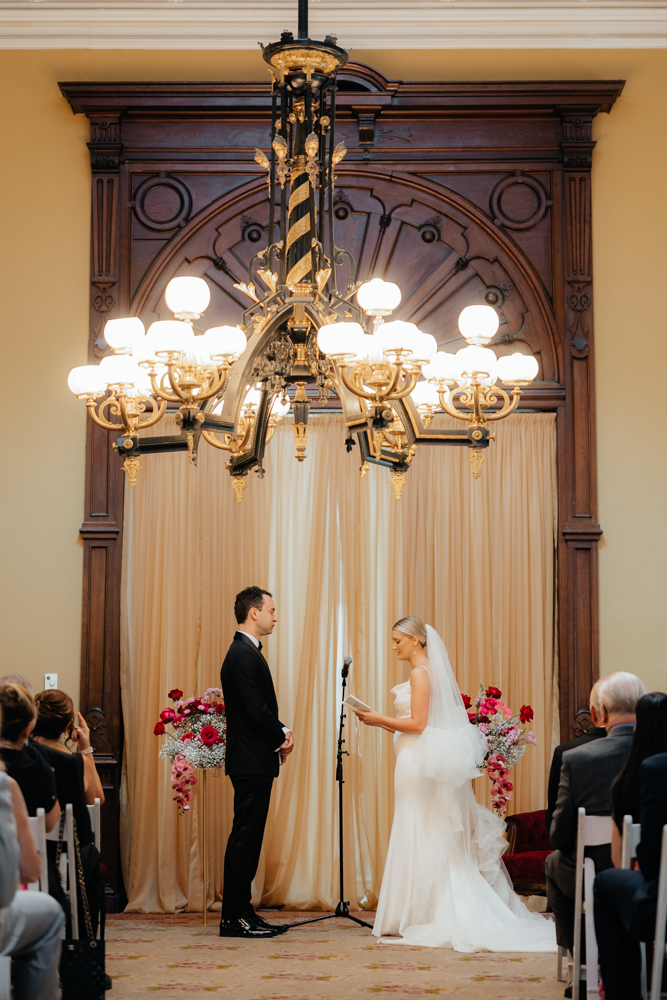 Bride and groom exchange vows at historical Canfield Casino venue in Albany, New York