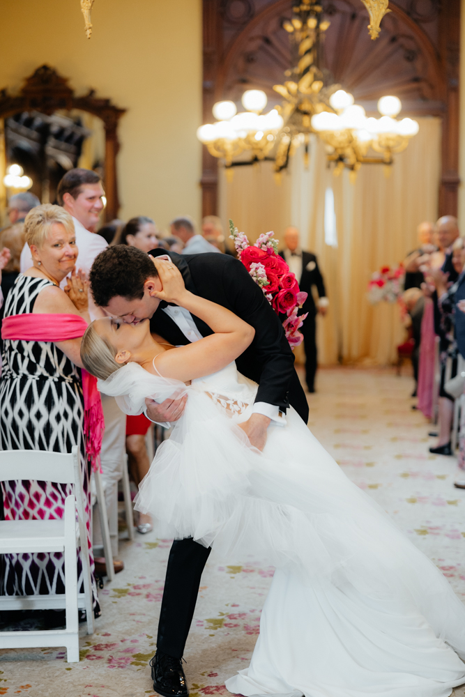 Bride and groom kiss at historical Canfield Casino venue in Albany, New York