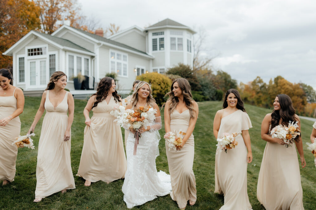 Candid of bride walking with her bridesmaids