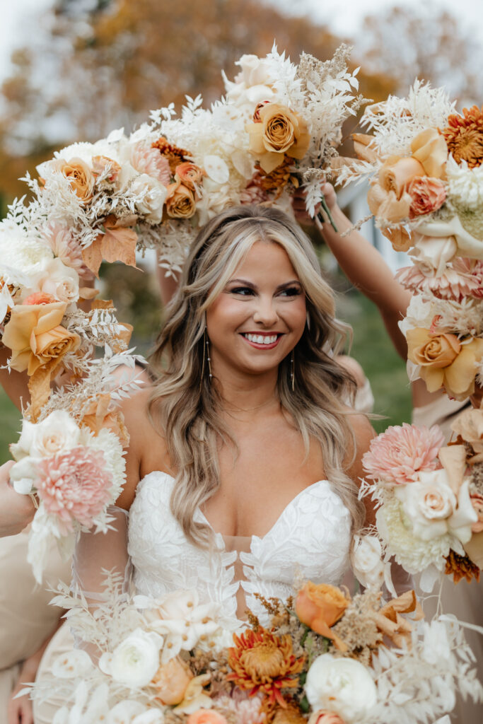 Bride in her lace wedding dress with her bouquet