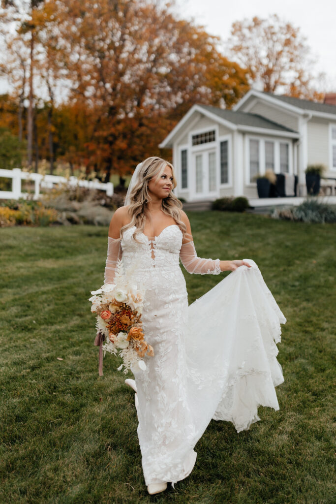 Bride in her lace wedding dress with her bouquet