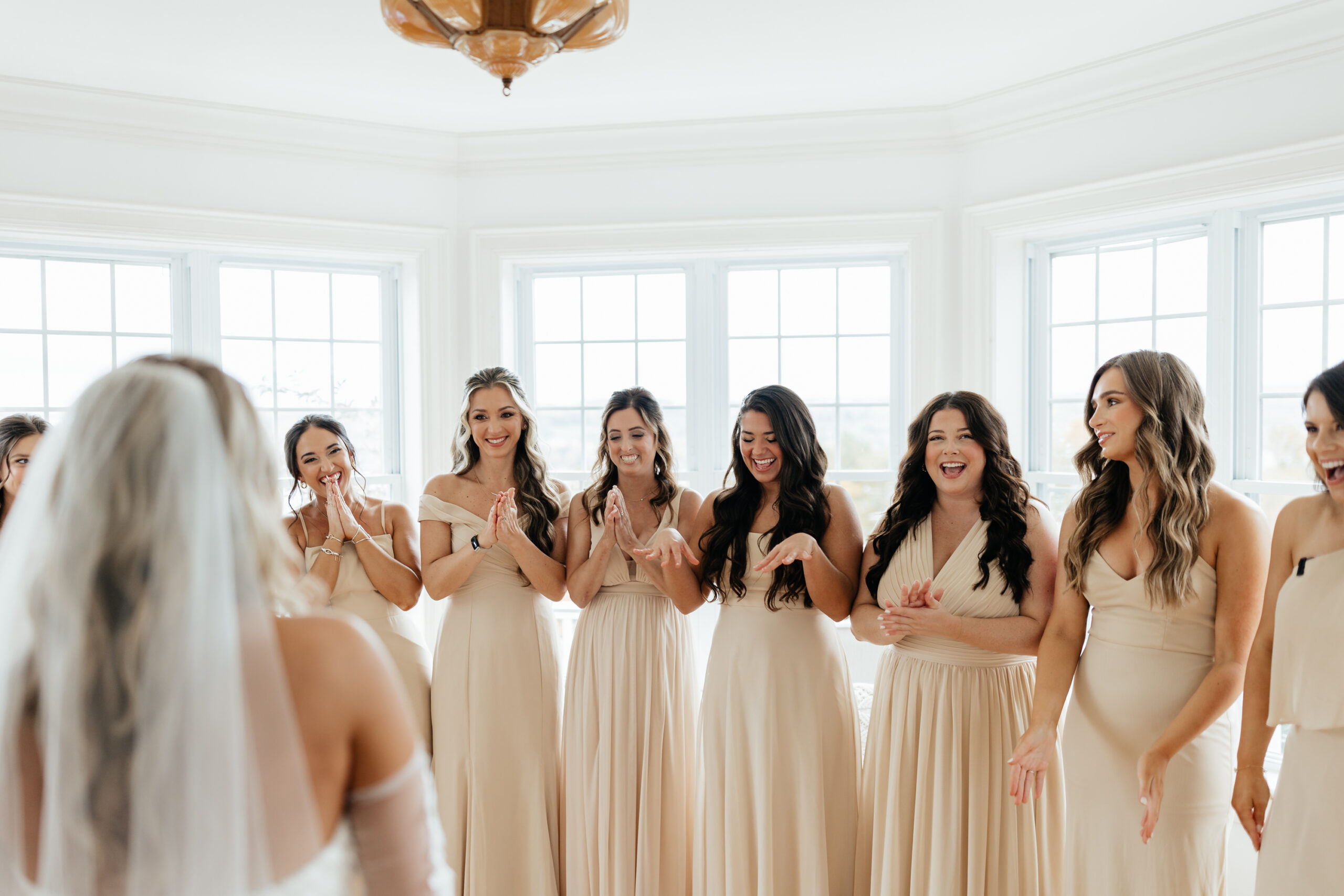 Bride doing a first look reveal with her bridesmaids