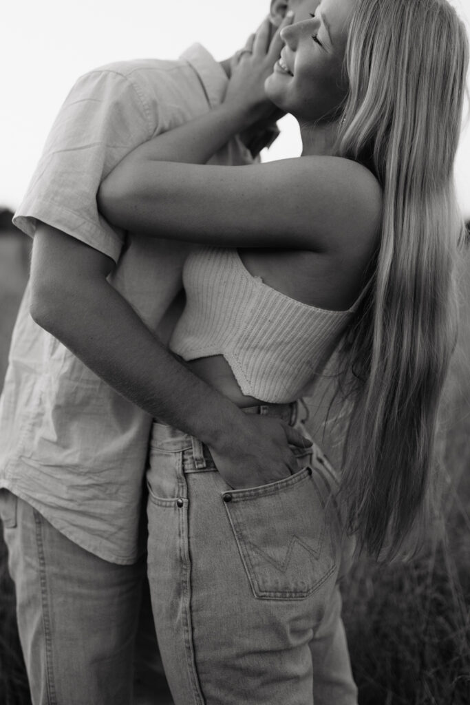 Couple in a field at sunrise