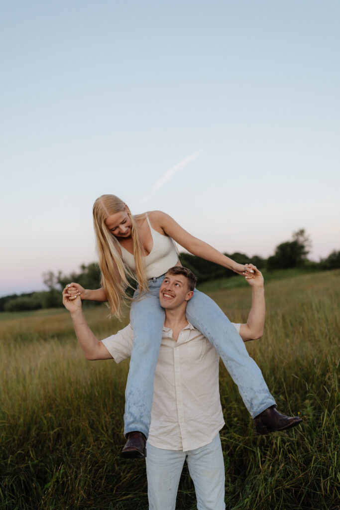 Couple in a field at sunrise