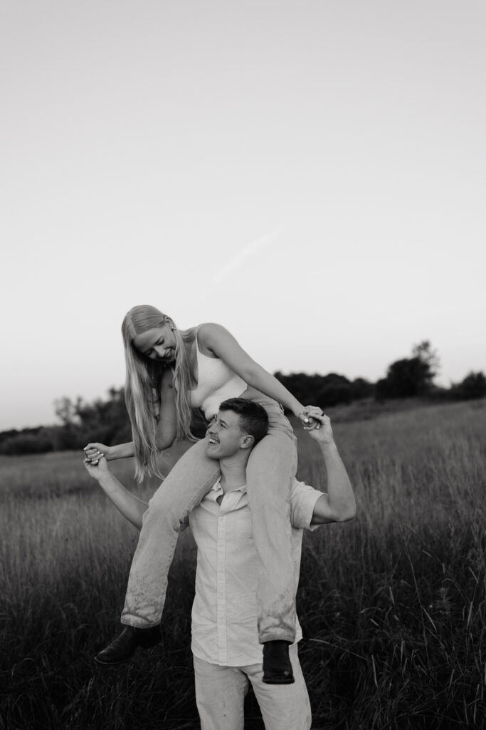 Couple in a field at sunrise