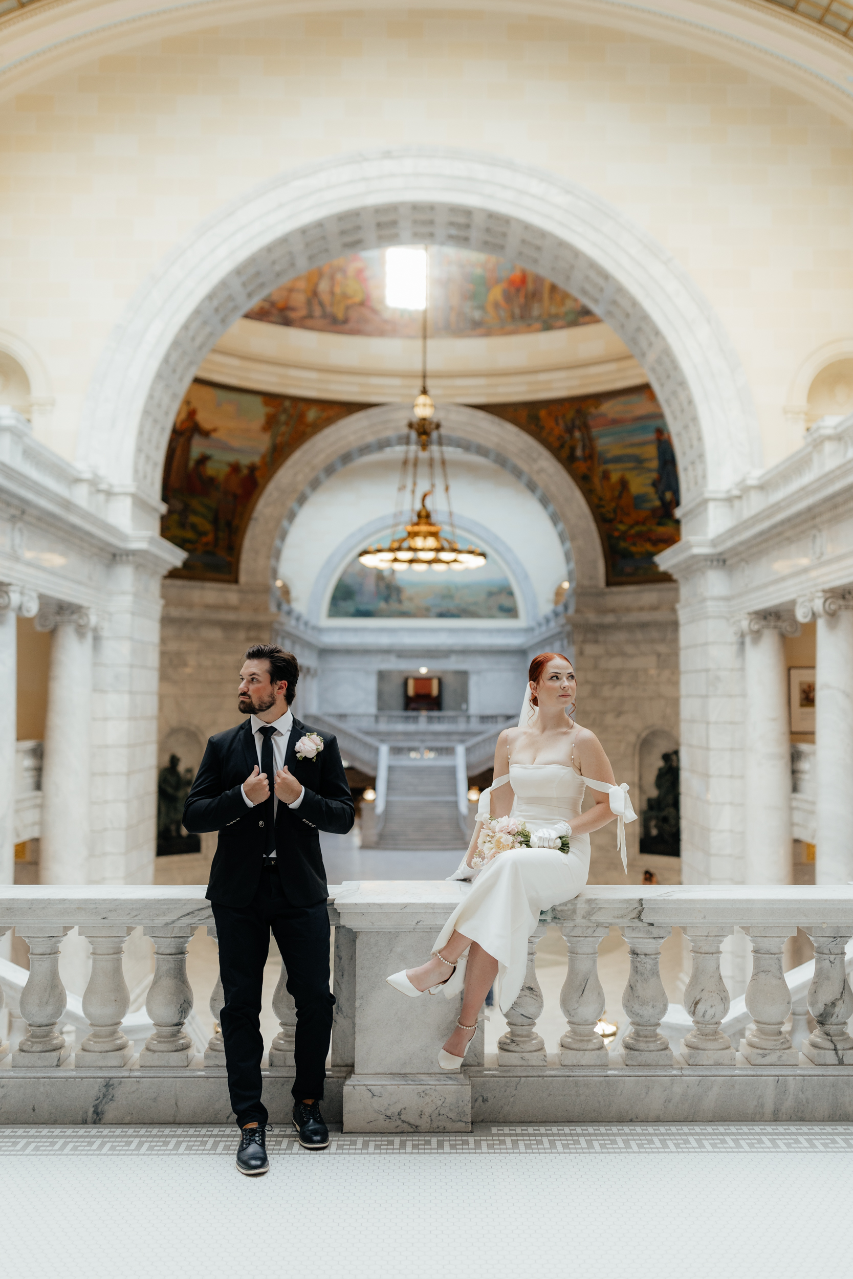 Couple eloping in salt lake city on balcony