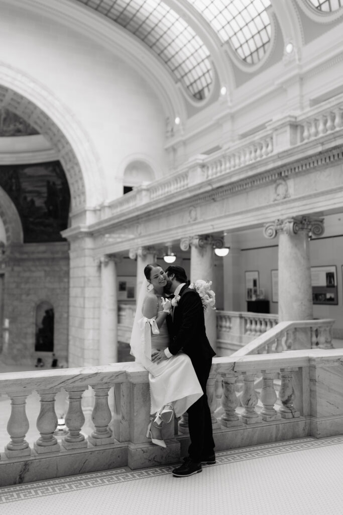 Couple eloping in salt lake city on balcony