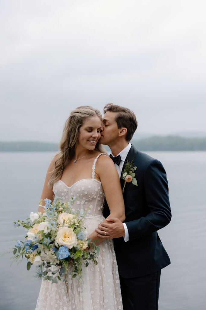 bride and groom portraits on the lake in the adirondacks