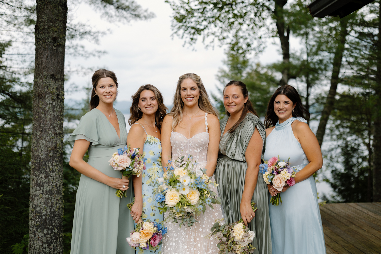 bride and her bridesmaids overlooking the Adirondack mountains