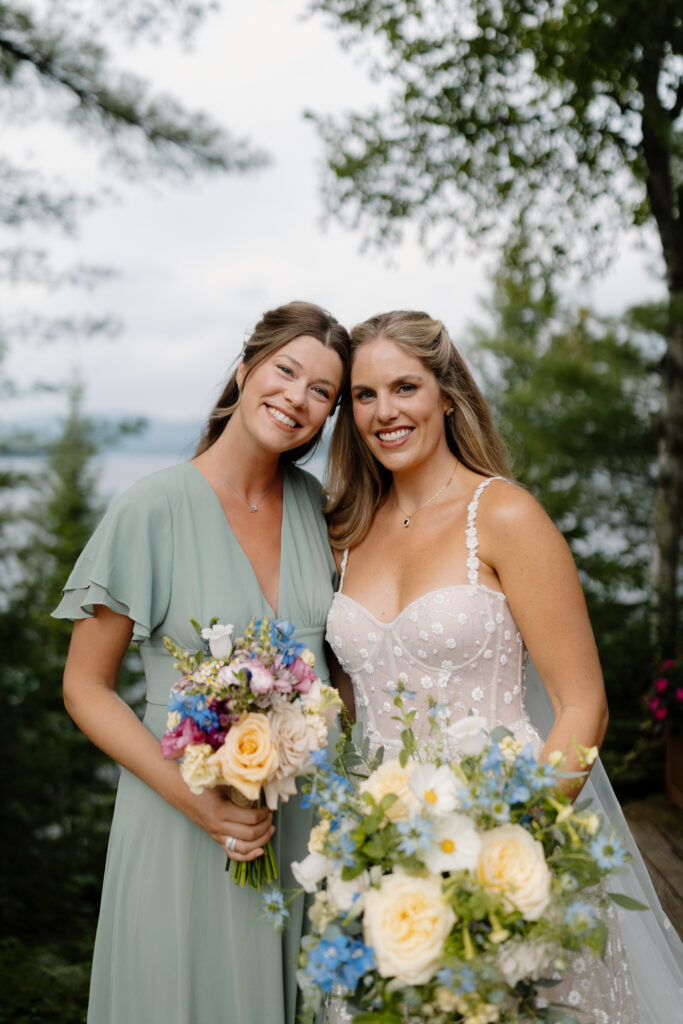 bride and her bridesmaid overlooking the Adirondack mountains