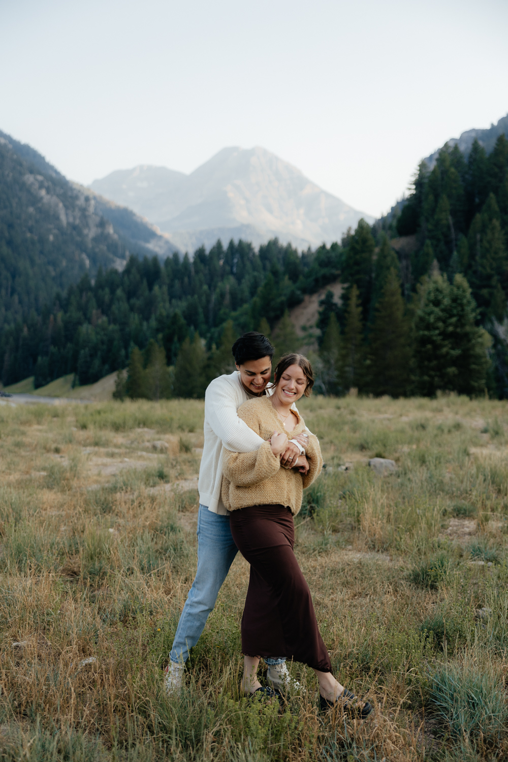 Couple plays around at TIbble Fork Reservoir in Utah Mountains