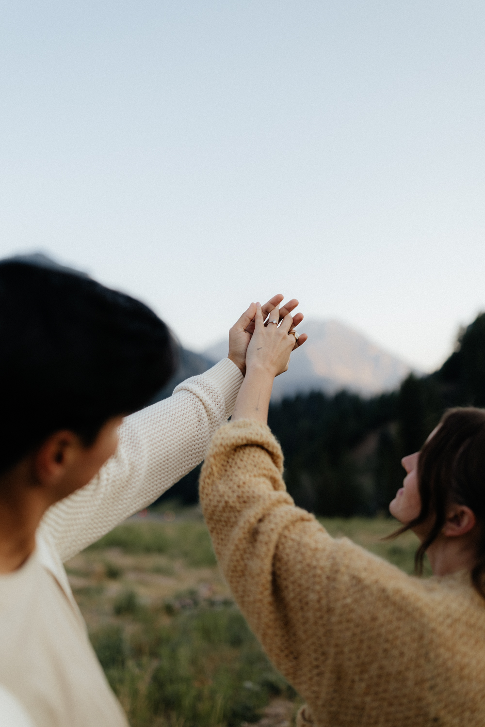 Couple holds hands at TIbble Fork Reservoir in Utah